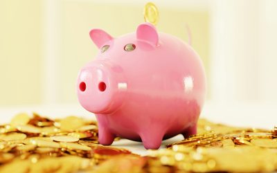 An illustrated piggy bank resting on lots of gold coins